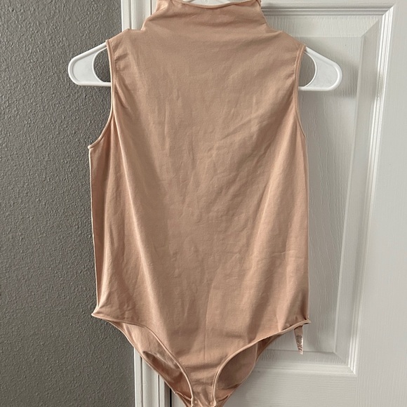 SKIMS Sleeveless Bodysuit in Cream - Picture 1 of 6